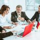 The business people working together at table. The meeting or summit concept